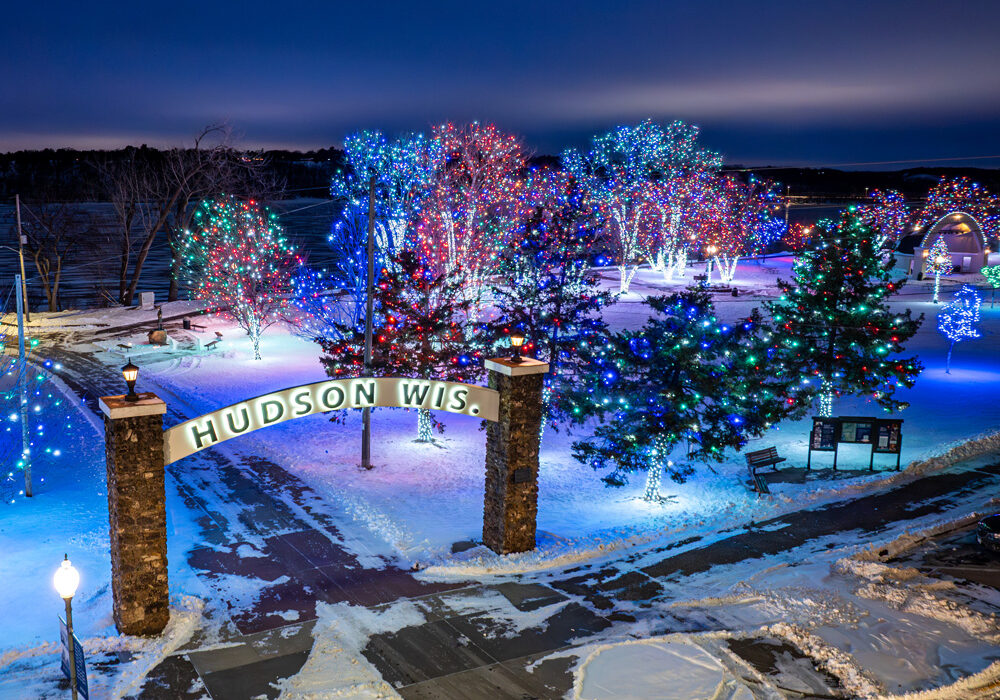 2025HudsonChristmasLightsinthePark-19-web Hudson Lakefront Park and historic arch in winter with christmas lights