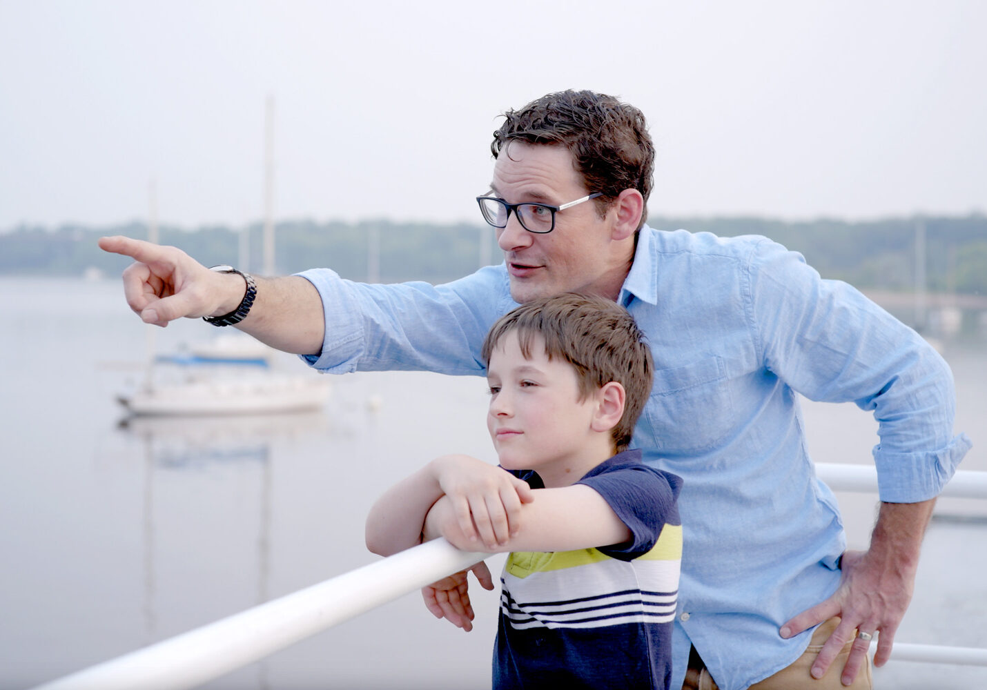 Father and son at marina on the St. Croix River.